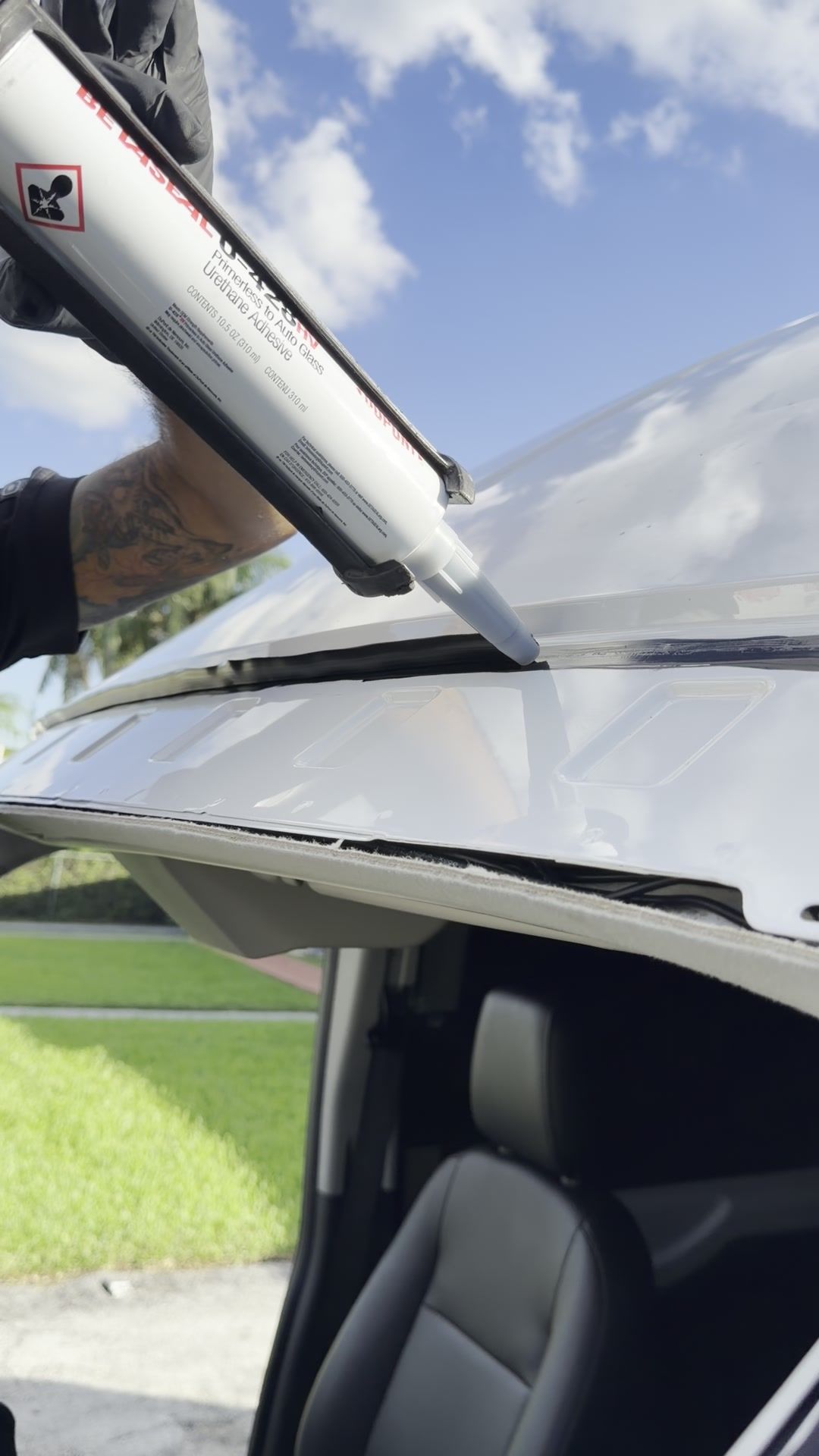 Laying a bead of urethane on the windshield frame