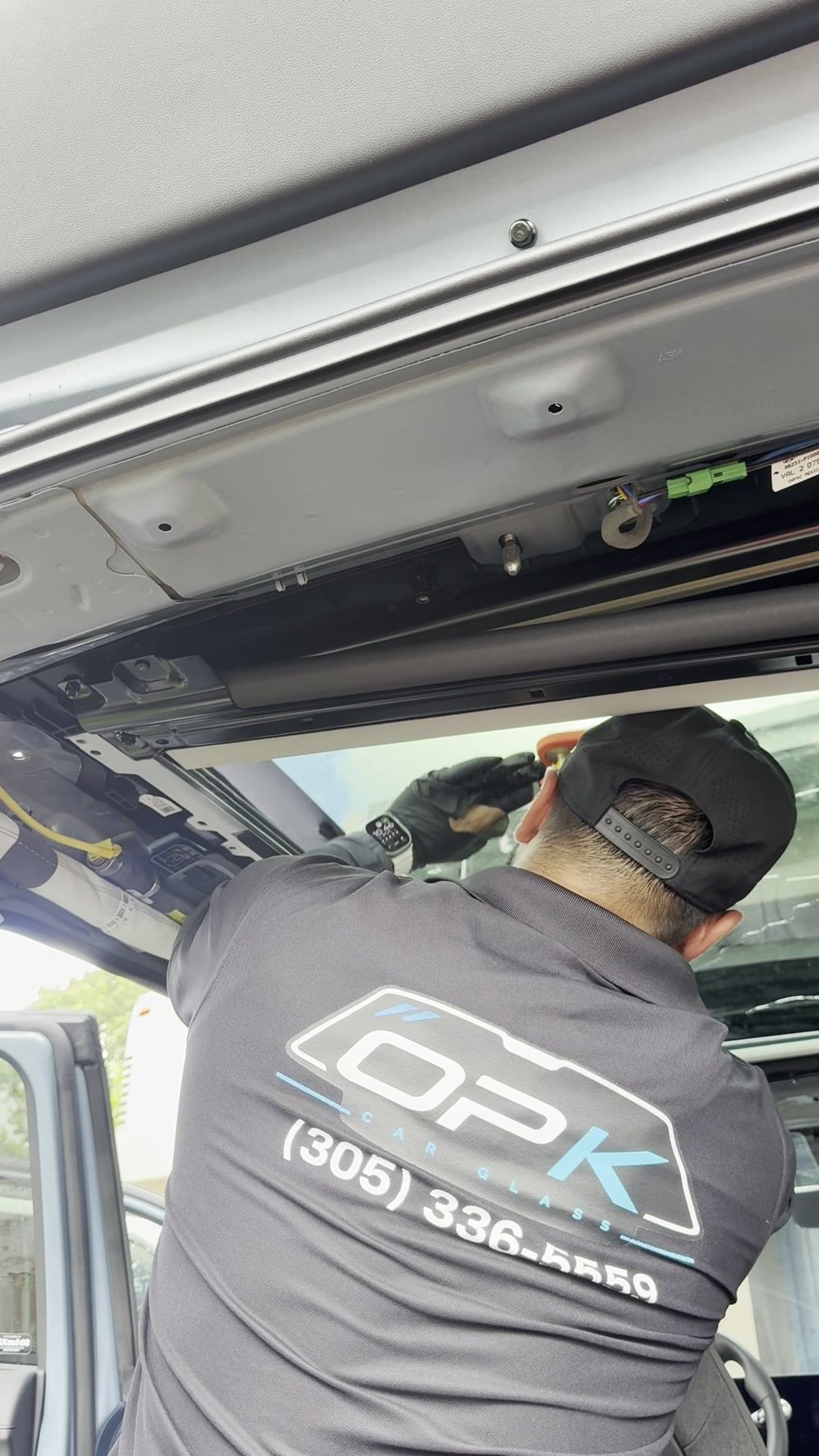 Technician working under the open roof of the Ioniq 5