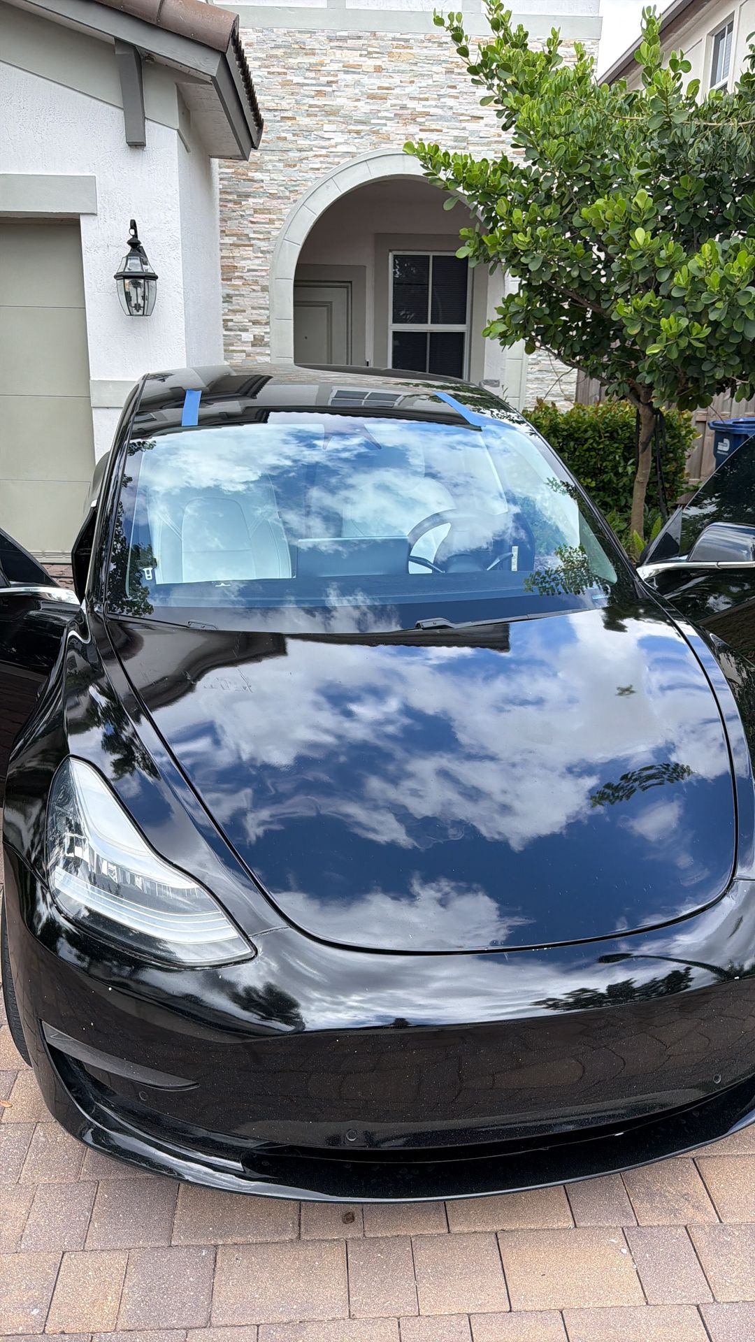 Tesla Model 3 with the new windshield taped in place